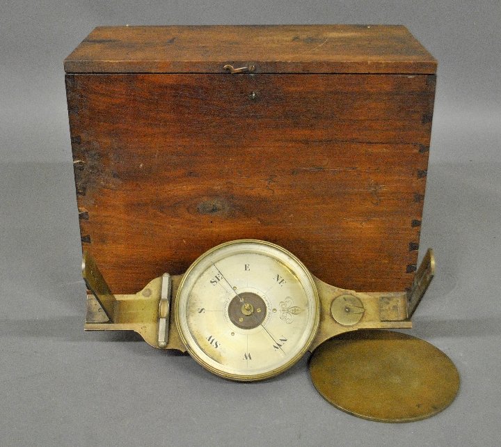 Charles F. Helffricht brass surveyor's compass,: Charles F. Helffricht brass surveyor's compass, Philadelphia, c.1850, in a dovetailed walnut case. Compass-8.75"w.x14.25"l., dial- 6.25" dia. Box-13"h.x16"w.x7.25"d.