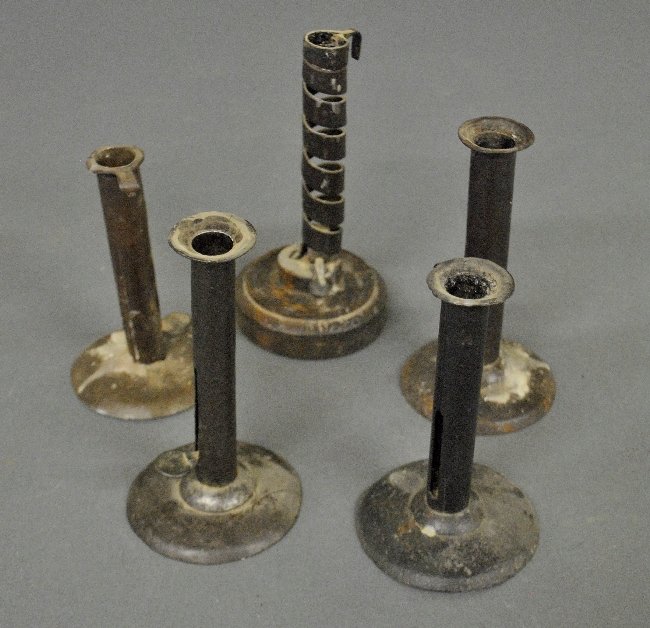 Four 19th c. tin hog scrapers, largest 7"h., and: Four 19th c. tin hog scrapers, largest 7"h., and another example.
