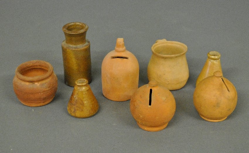 Five unglazed redware pieces incl. two penny banks: Five unglazed redware pieces incl. two penny banks 5"h., and three stoneware pieces