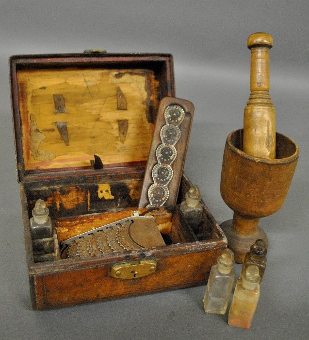 Leather cased medical box with a wood mortar and (1 of 2)