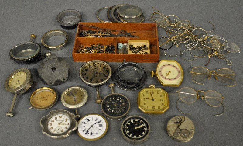 Grouping of car clocks, watch parts, and eyeglasses, (1 of 3)