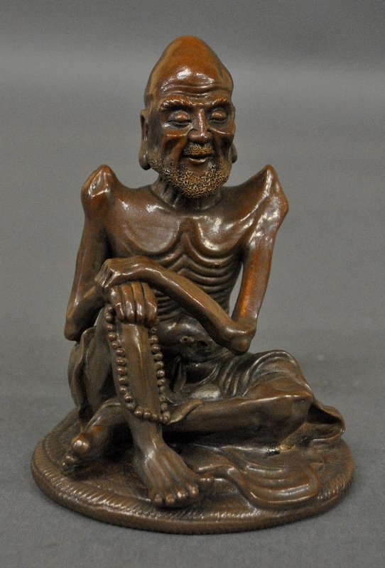 Asian brown pottery, Lo Han Seated figure, 6"h.x4"w. (1 of 2)
