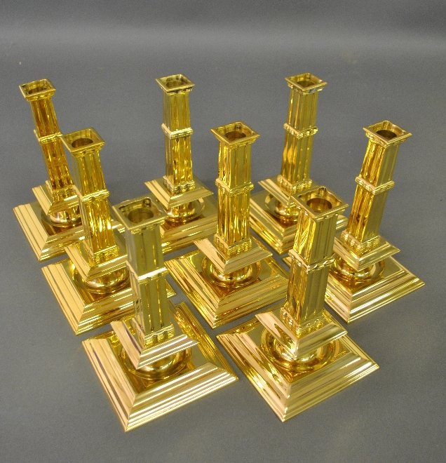 Eight reproduction brass column candlesticks. (1 of 1)