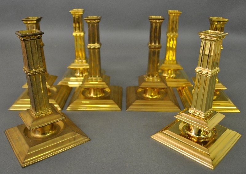 Eight reproduction brass column candlesticks. (1 of 1)