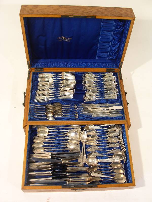 Cased sterling silver flatware (12) by Wallace: Oak cased sterling silver flatware service for twelve by Wallace Silversmiths in the "Princess Mary" pattern, 1922, monogrammed "H", 86 pieces total.