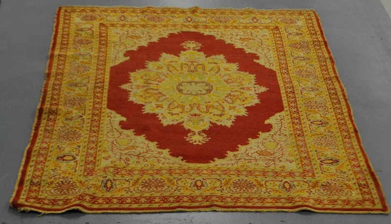 Turkish oriental carpet with a red field and center (1 of 2)