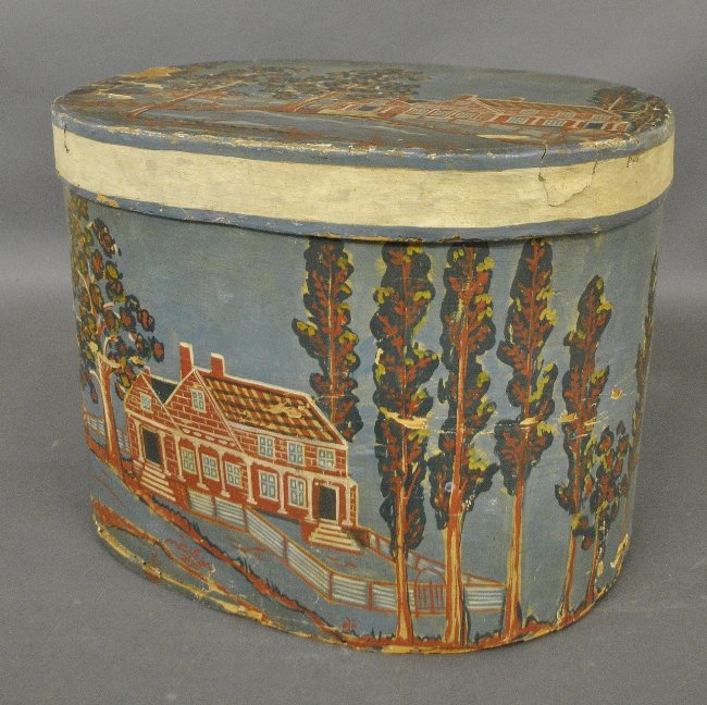 Hand-painted oval hatbox decorated with a brick house (1 of 3)