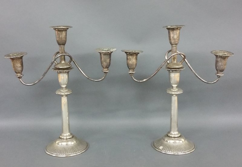Pair of weighted silver plate candelabra. 17" h x 16" w (1 of 2)