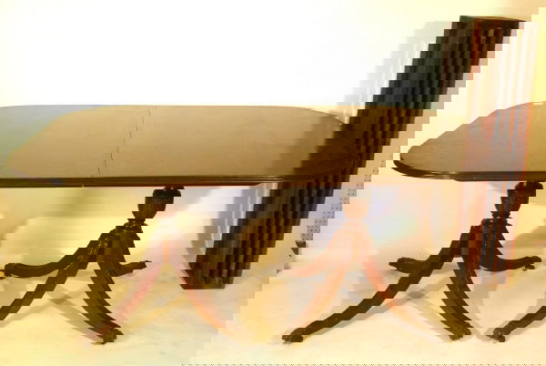 Duncan Phyfe style mahogany two pedestal base dini: Duncan Phyfe style mahogany two pedestal base dining table, four extra leaves.29"h.x66"l.x43"w., leaves 9"w.