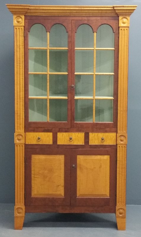 Tiger maple and cherry one-piece corner cabinet signed: Tiger maple and cherry one-piece corner cabinet signed "David Smith and Company Cabinet Makers and Grainers, Morrow, Ohio." 87 ¼ inches high, 44 inches wide, 23 inches deep