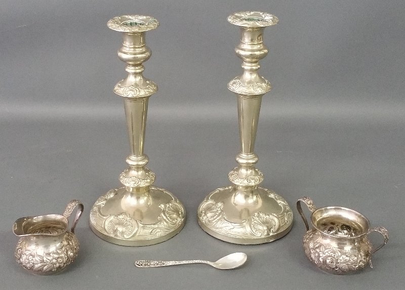 Pair of hallmarked, weighted silver candlesticks and a (1 of 2)