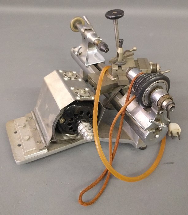 Peerless Jewelers lathe with tool holding tailstock. 8: Peerless Jewelers lathe with tool holding tailstock. 8 inches high, 13 inches wide.