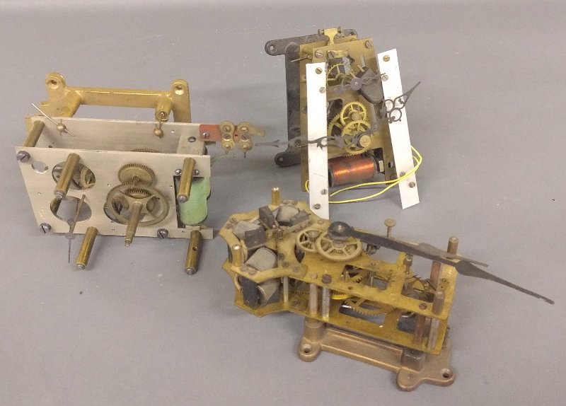 E. Howard & Co., Boston electromagnetic clockworks, 6: E. Howard & Co., Boston electromagnetic clockworks, 6 inches high x 6 inches wide, together with a Seth Thomas example and an unsigned example.