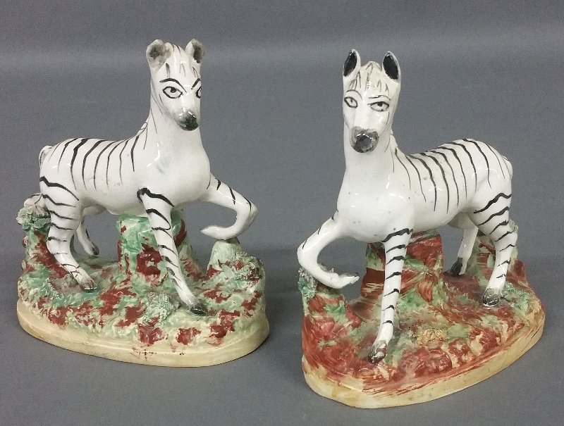 Pair of Staffordshire prancing zebras. 5 inches high, 5: Pair of Staffordshire prancing zebras. 5 inches high, 5 inches wide.