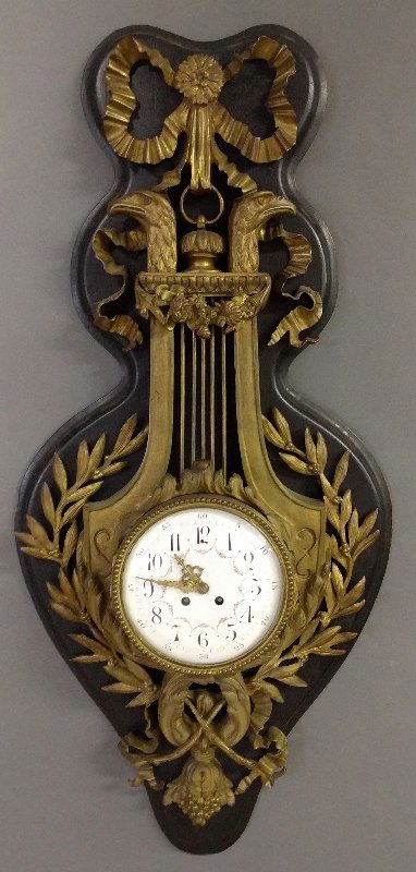 French bronze cartel wall clock with black oak back, c. (1 of 3)