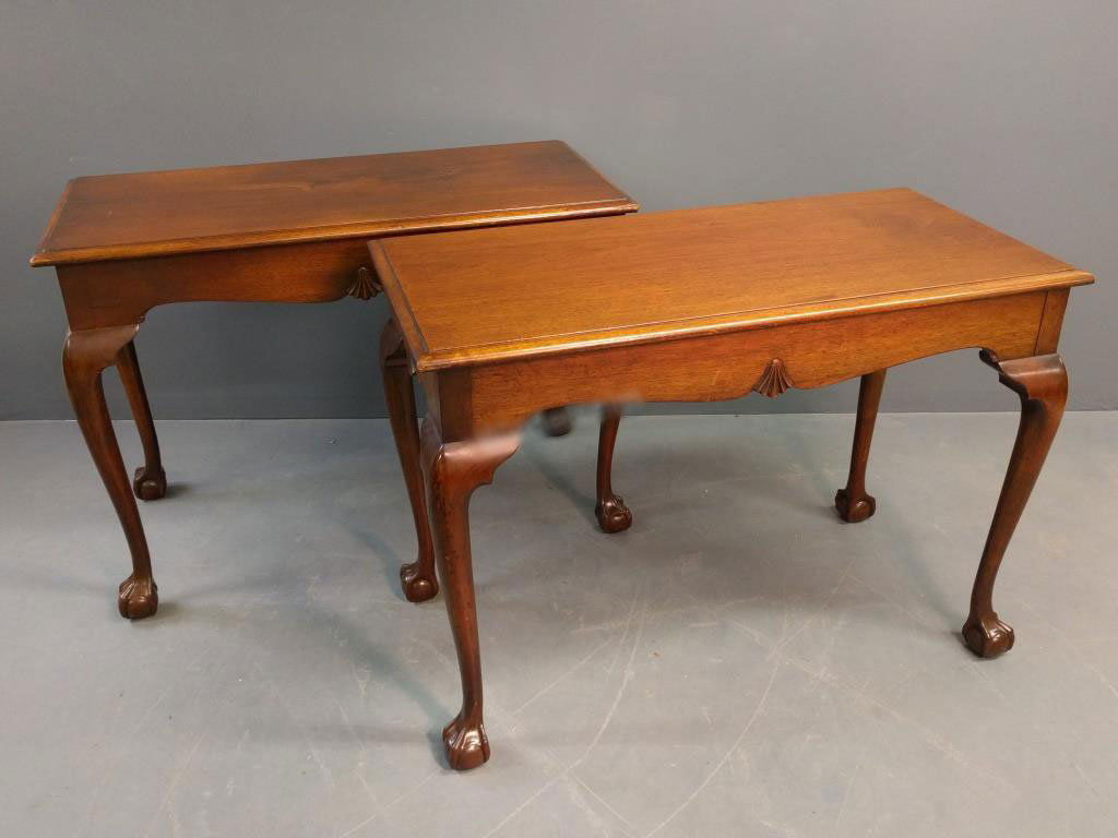 Pair of tables: Pair of Chippendale style mahogany ball and claw footed console tables. 30.5"h x 42"w x 20.5"d