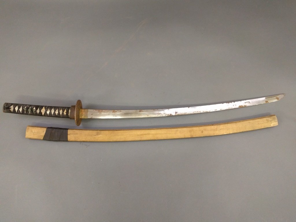 Japanese katana sword with wrapped shagreen handle and: Japanese katana sword with wrapped shagreen handle and iron tsuba. 42"l.