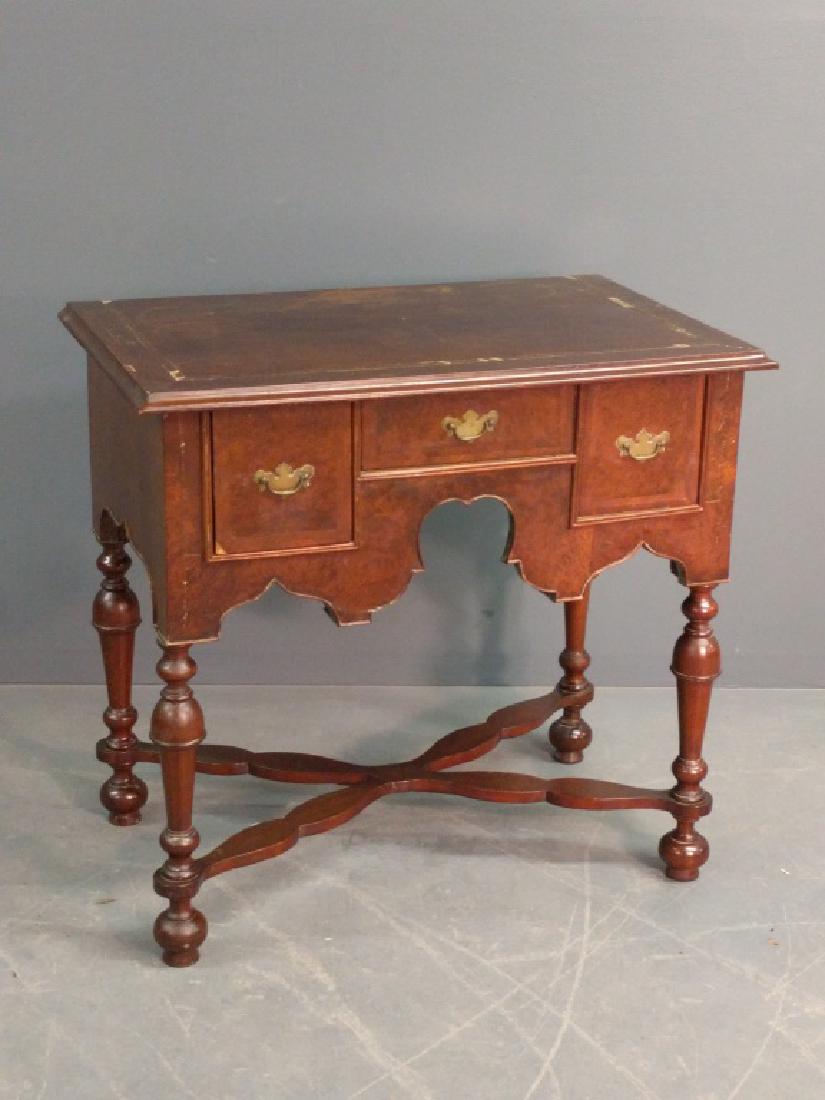 English William & Mary lowboy: English William & Mary oyster veneered lowboy with herringbone inlaid top. 31"h. x 33.5"w.