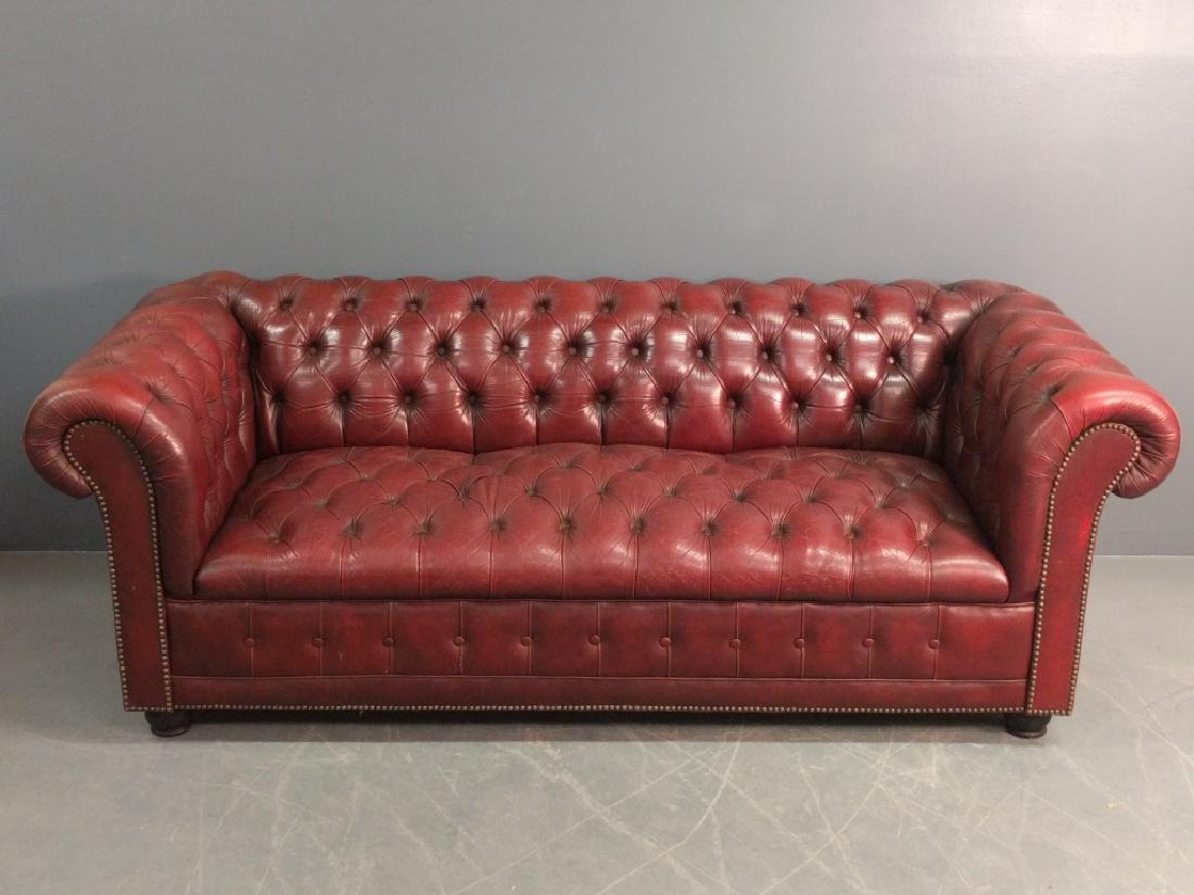 Chesterfield sofa: Tufted Chesterfield leather sofa. 27"h. x 73"w. x 33"d. Seat height 17.5".
