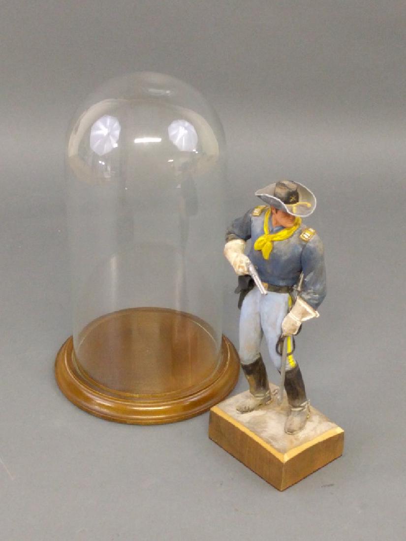 Clement H. Donshea (American 1871-1970): Clement H. Donshea (American 1871-1970) original single wood carving figure of a US Cavalry Captain, circa 1876 signed and inscribed, "Original wood carving by Clemente Donshea" on the base, with glas