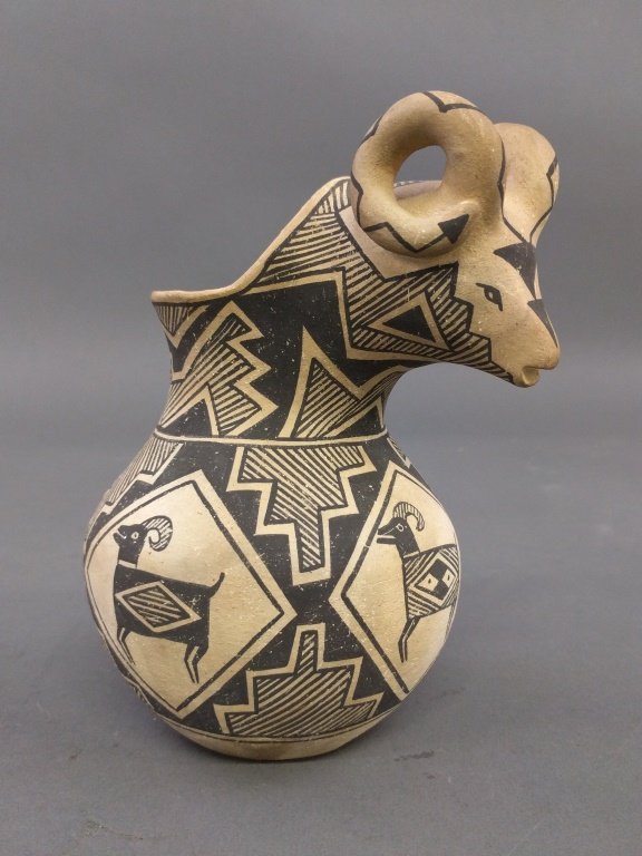 Southwest Indian pottery vessel with decorated rams hea (1 of 2)