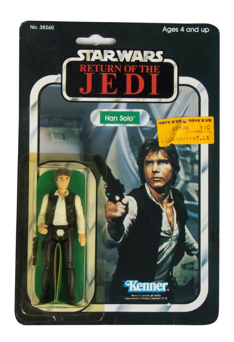 Kenner "Return of the Jedi" Han Solo Figure.: (Kenner, 1983) A rare Han Solo action figure created by Kenner for "Return of the Jedi". This figure is unopened in its original packaging and still retains its original Toys 'r' Us sales sticker on t