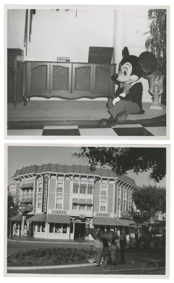 Pair of Wurlitzer Music Hall Photos.: (Disneyland, c.1950s-60s) A pair of photos of the exterior and interior of Main Street's Wurlitzer Music Hall. The black and white photos depict the beautiful entrance to the store with a Main Street 