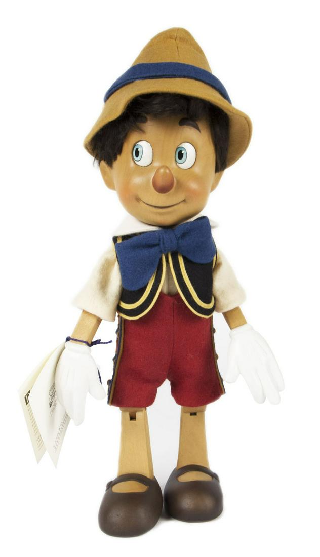 Pinocchio R. John Wright Doll.: (Wright, 2000) A very rare Pinocchio doll created by R. John Wright that was exclusively made for Disneyland. This doll is numbered 226/500, and was created in alpine maple with a felt costume. The do