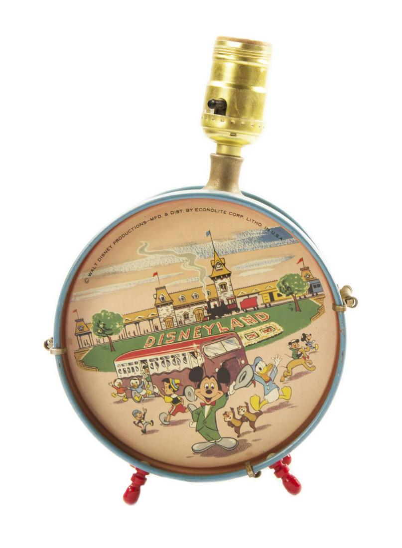 Disneyland Tin-Litho Drum Lamp.: (Disneyland, c.1955) A beautiful tin-litho drum lamp created by Econolite for Disneyland. The lamp features matching imagery on both sides depicting Mickey and friends arriving at Disneyland. The shad