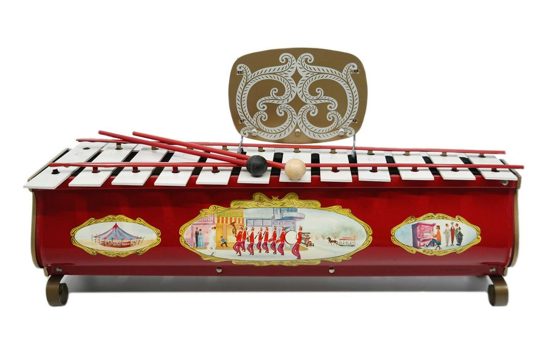 Disneyland Xylophone Toy in Box.: (Disneyland, c.1961) A souvenir xylophone toy from the early years of Disneyland. The metal xylophone has decorative Disneyland imagery on both sides and comes in its original box with two mallets for