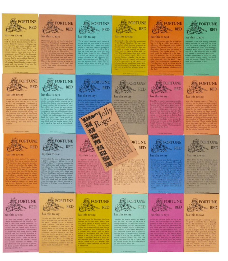 Set of (25) Fortune Red Pirate Cards.: (Disneyland, c.1990s) A set of (25) fortune cards from the Fortune Red machine located near the Pirates of the Caribbean attraction at Disneyland. Each card has a fortune written in pirate speech and 
