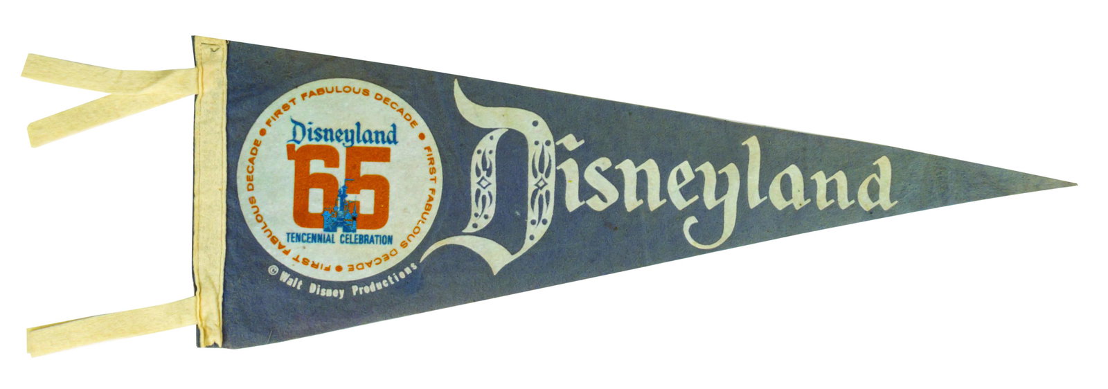 Disneyland Tencennial Celebration Pennant.: (Disneyland, 1965) A stylish pennant created to celebrate Disneyland's 10th anniversary. The pennant measures 8.5"x24" and is in good condition with minor creasing and some color-wear throughout.