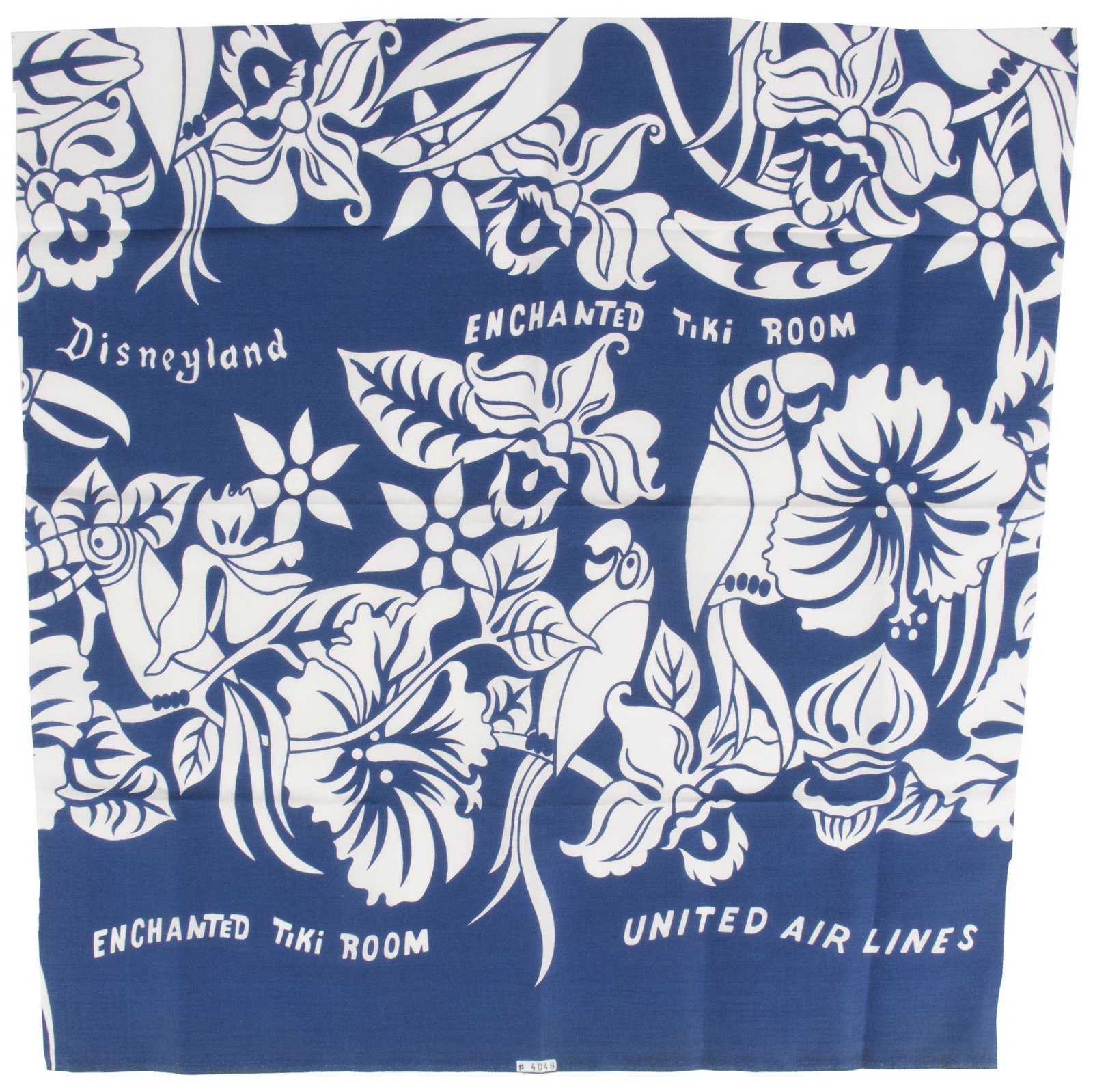 Enchanted Tiki Room Fabric Swatch.: (Disneyland, c.1960s) A swatch of blue fabric featuring a pattern seen in the Enchanted Tiki Room cast member uniforms of the 1960s. Interspersed throughout the tiki birds and flower imagery are the n