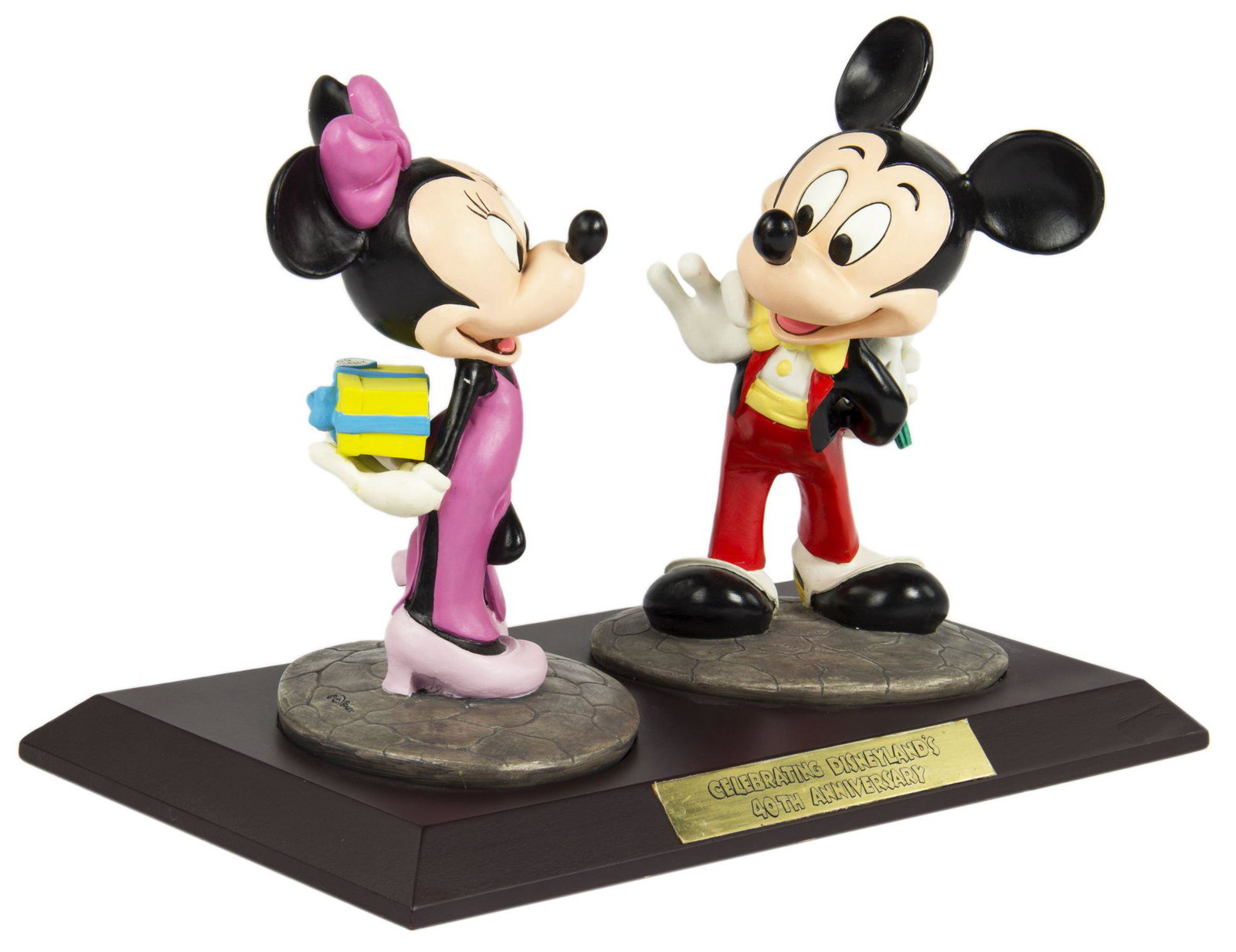 Mickey & Minnie Disneyland 40th Anniversary Figure.: (Disneyland, 1995) A limited edition figurine of Mickey and Minnie created to celebrate the 40th anniversary of Disneyland. Created in resin, the figurines are standing over a wooden base with an engr