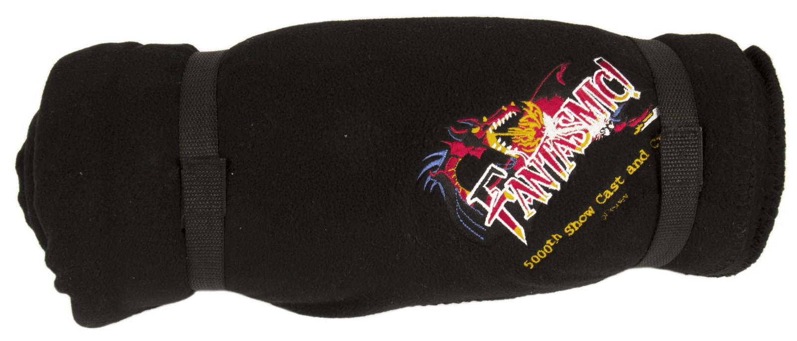 Fantasmic! 5000th Show Cast Member Blanket.: (Disneyland, c.2000s) A cast and crew fleece blanket created to celebrate the 5000th show of Fantasmic! at Disneyland. The black blanket has a stylish logo for the attraction and details about the 500