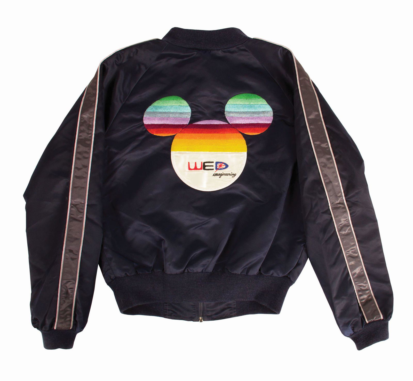 WED Imagineering Employee Jacket.: (Walt Disney World, 1980s) An original jacket from WED Imagineering featuring a fantastic 1980s color pattern within the Walt Disney World logo on the reverse. The jacket has the employee name Candy s