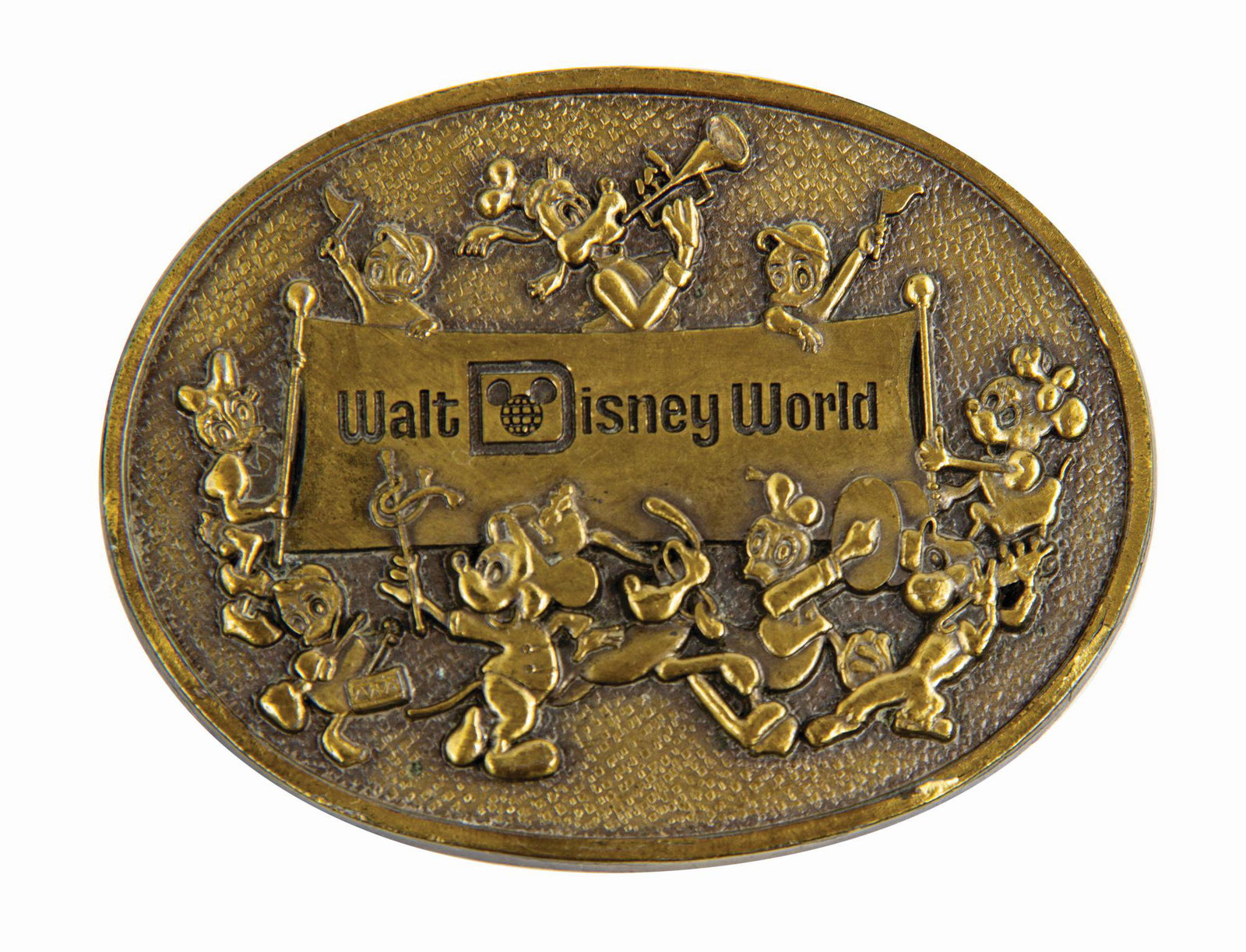 Walt Disney World Brass Belt Buckle.: (Walt Disney World, c.1980s) A rare souvenir brass belt buckle from Walt Disney World that features an assortment of classic Disney characters. This charming vintage souvenir measures approximately 2.