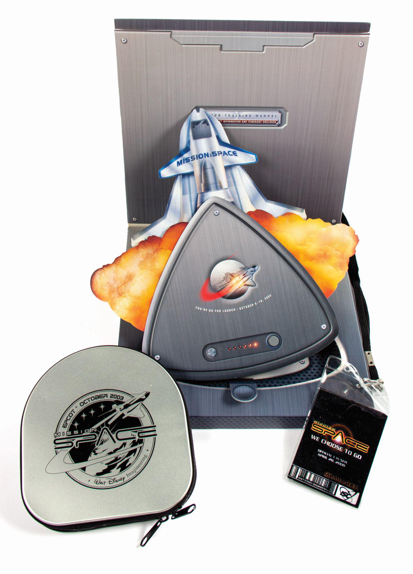 Mission: Space Grand Opening Items.: (Epcot, 2003) A collection of rare items from the grand opening of Epcot's Mission: Space attraction. This collection includes an invitation to the "Official Launch" in October of 2003, an Imagineerin