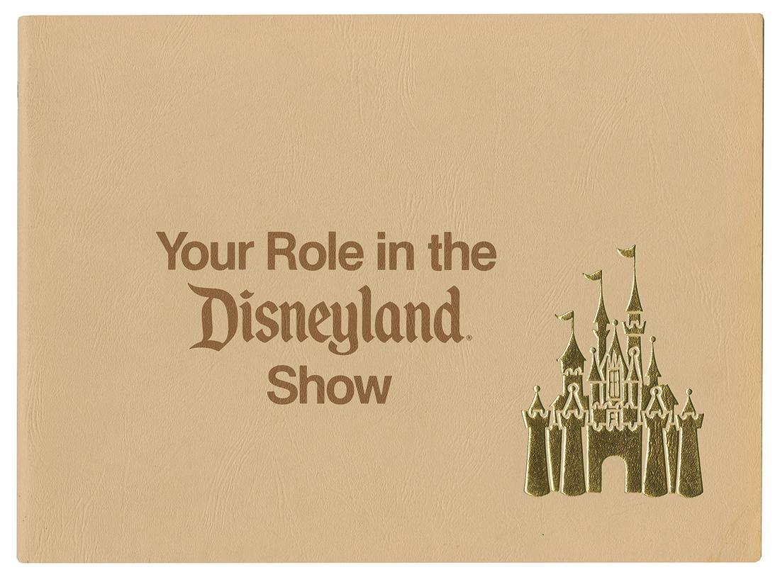 "Your Role in the Disneyland Show" Cast Member Booklet.: (Disneyland, 1973) A book created for new cast members at Disneyland featuring a beautiful gold embossed Sleeping Beauty Castle logo on the cover. The book covers general expectations of Disneyland em