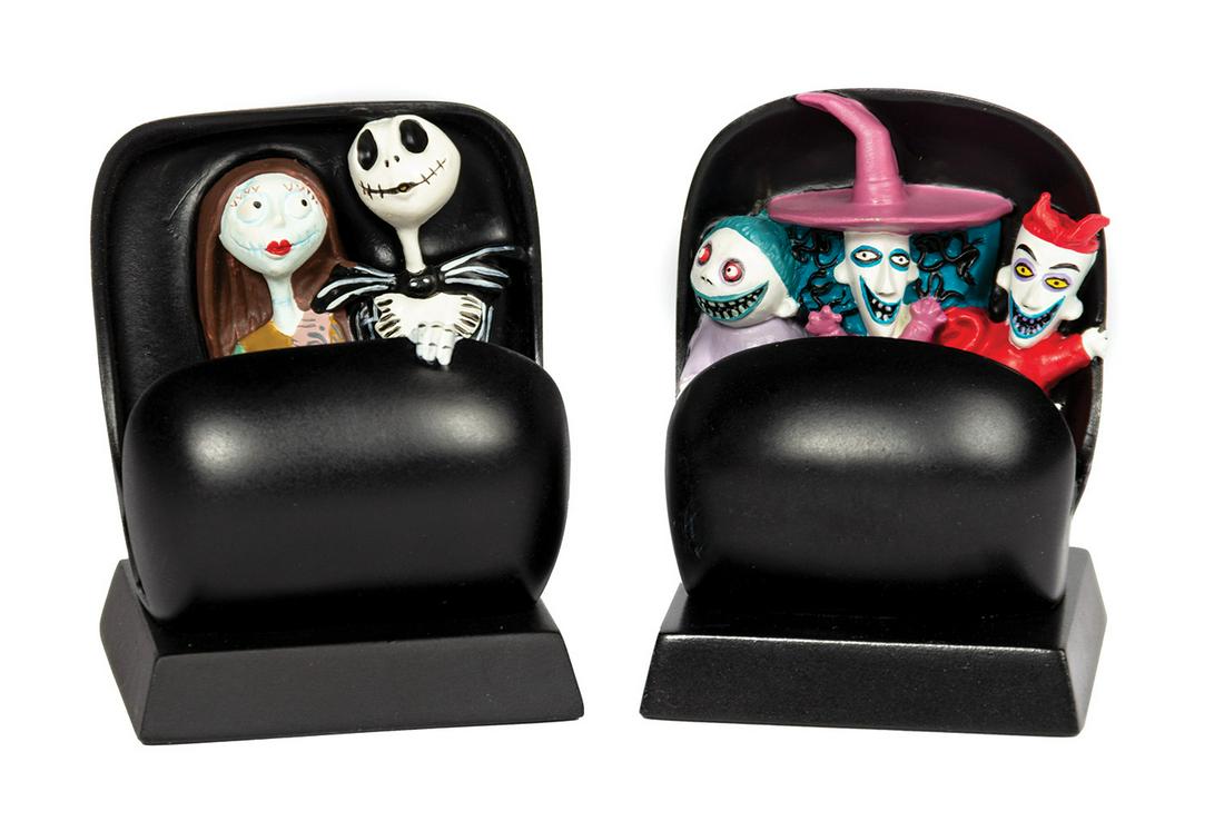 Pair of Haunted Mansion Holiday Doom Buggy Figures.: (Disneyland, c.2001) A pair of figures based on characters from The Nightmare Before Christmas. The figures are depicted riding the familiar Doom Buggy vehicles from the Haunted Mansion, and were crea