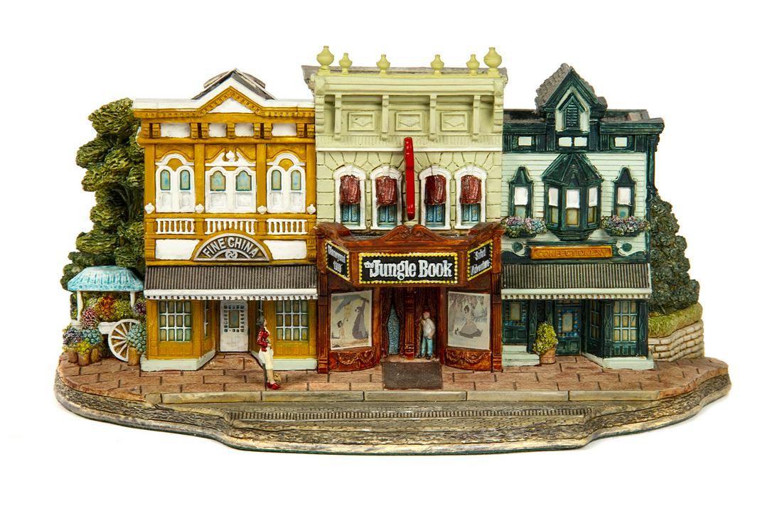 Lilliput Lane Main Street Cinema Model.: (Walt Disney World, 1999) A beautiful model of the Main Street Cinema created by artist Ray Day for Lilliput Lane. The model was offered at the Official Disneyana Convention, and is signed by Day and
