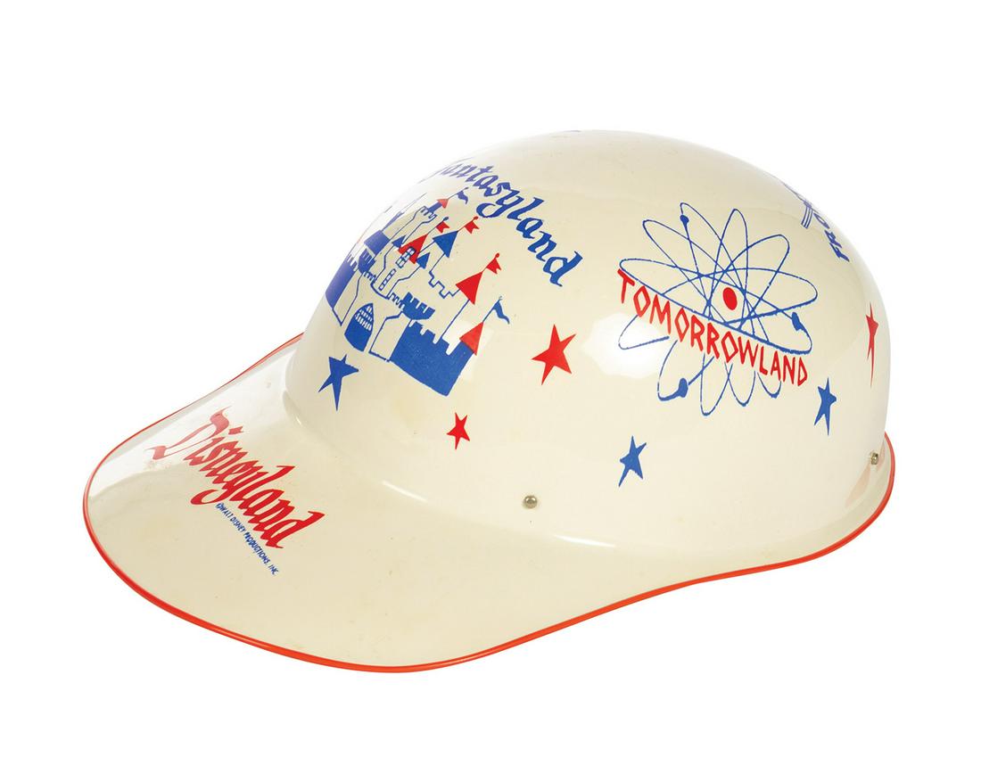 White Souvenir Keppy Kap.: (Disneyland, c.1956) A souvenir white "Keppy Kap" featuring artwork of the different lands of the park. Measuring 11.25"x7" and 4.5" tall, the child's cap is in very good condition with minor wear.