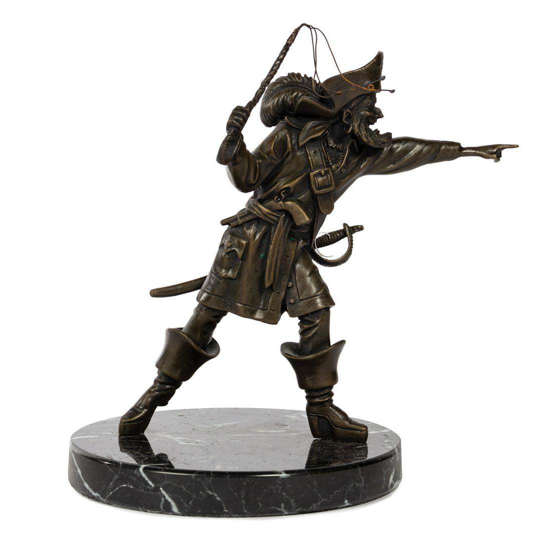Pirates of the Caribbean Bronze Auctioneer Figure.: (Disneyland, 2005) A bronze figure of the Auctioneer from Disneyland's Pirates of the Caribbean attraction. The sculpture was created as part of a limited edition of 1500 pieces to celebrate the 50th 