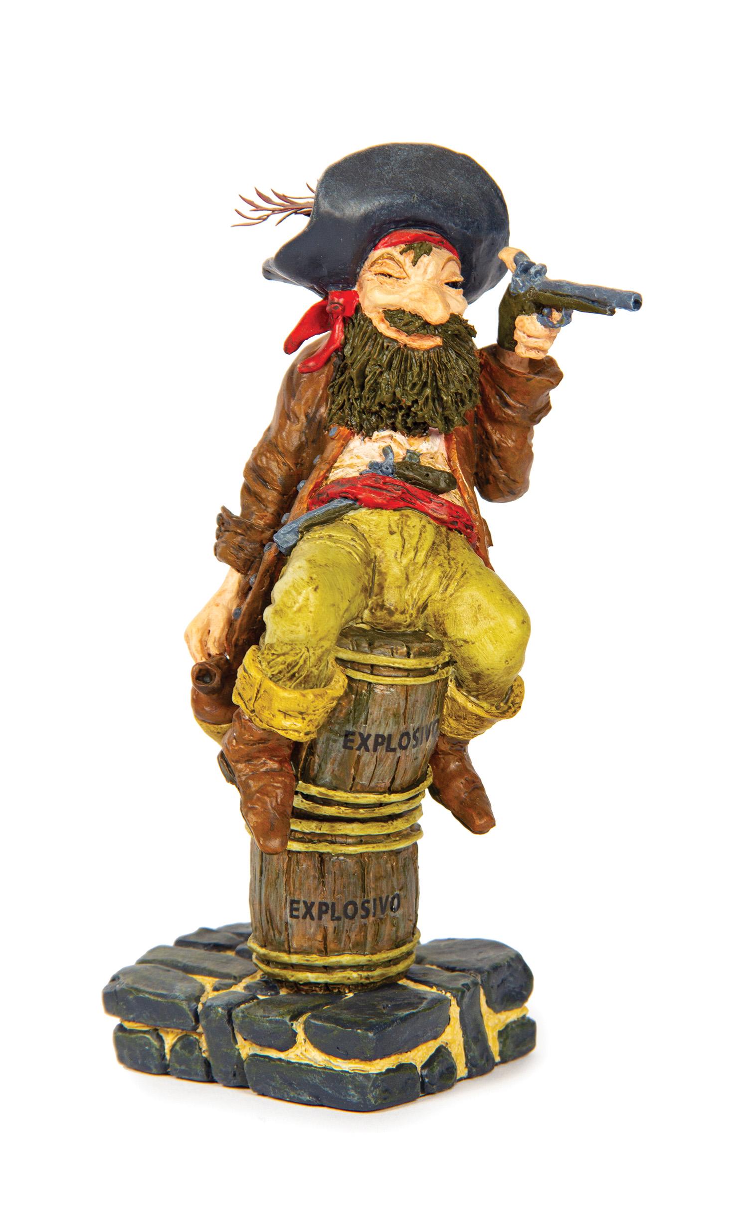 Pirates of the Caribbean Limited Edition Event Figure.: (Disneyland, c.2000) A limited edition Pirates of the Caribbean figure from a special event at Disneyland. The figure features the drunk pirate that is aiming a pistol while sitting on two explosive b