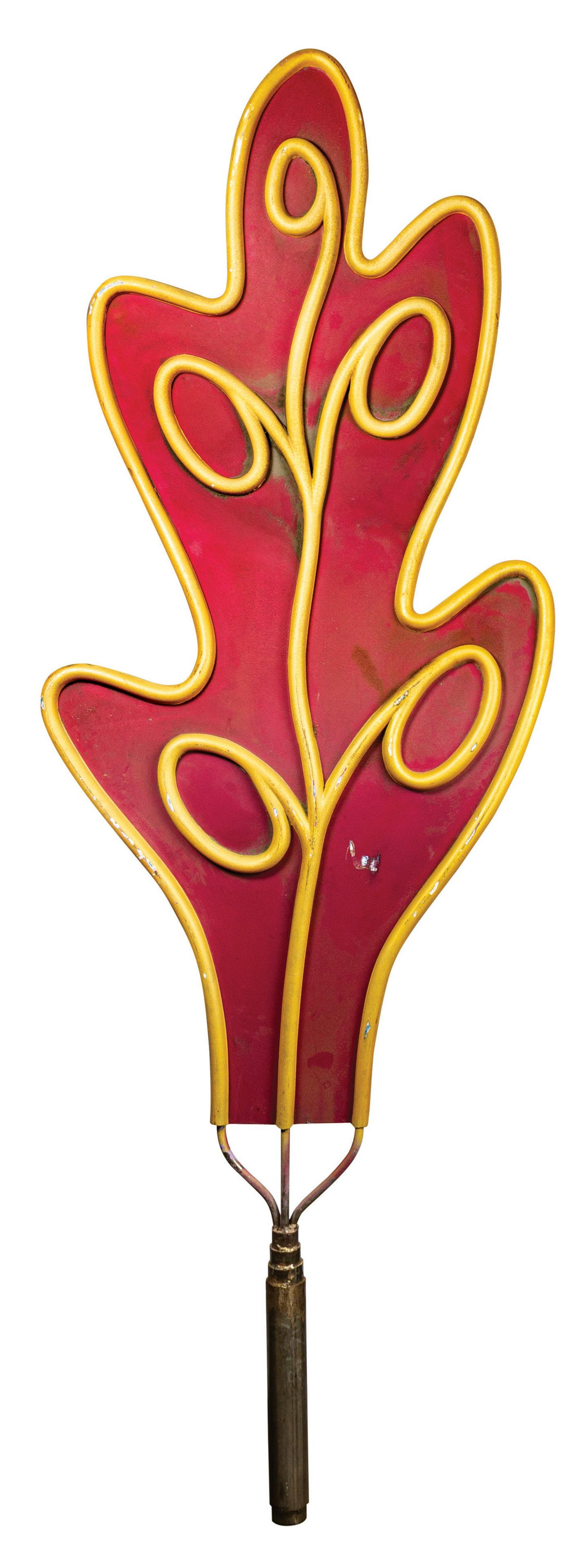 Alice in Wonderland Leaf Prop.: (Disneyland, c.1980s) An original leaf prop from the exterior of the Alice in Wonderland attraction at Disneyland. Composed of hand-painted fiberglass with a heavy metal pole at the base, this double-