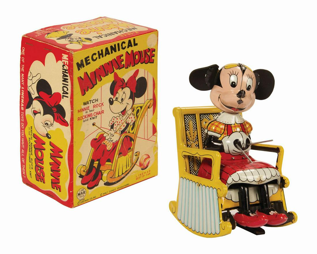 Mechanical Minnie Mouse Wind-Up Tin Toy.: (Disney, c.1950s) A vintage Mechanical Minnie Mouse tin-litho figure with mechanical spring wound action manufactured by LineMar. When the integral winding key on the bottom of the figure is turned, t