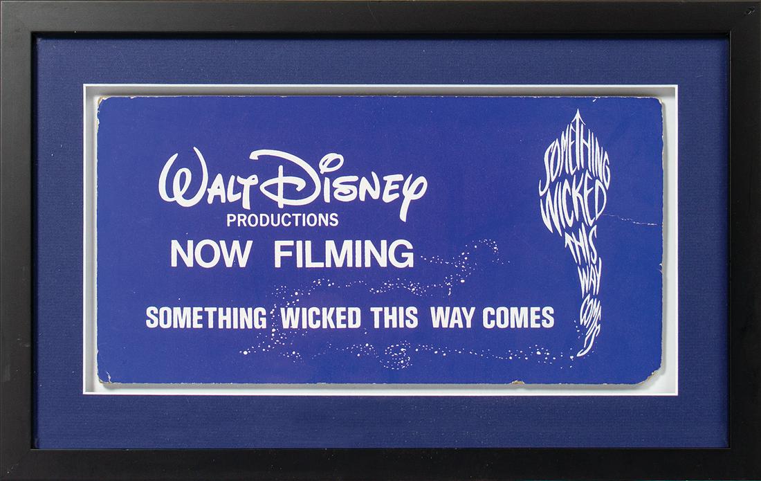 Something Wicked This Way Comes Crew Sign.: (Disney, 1983) A "now filming" sign used during the production of the feature film Something Wicked This Way Comes. Placards such as this one were placed on the dashboards of production and crew vehic