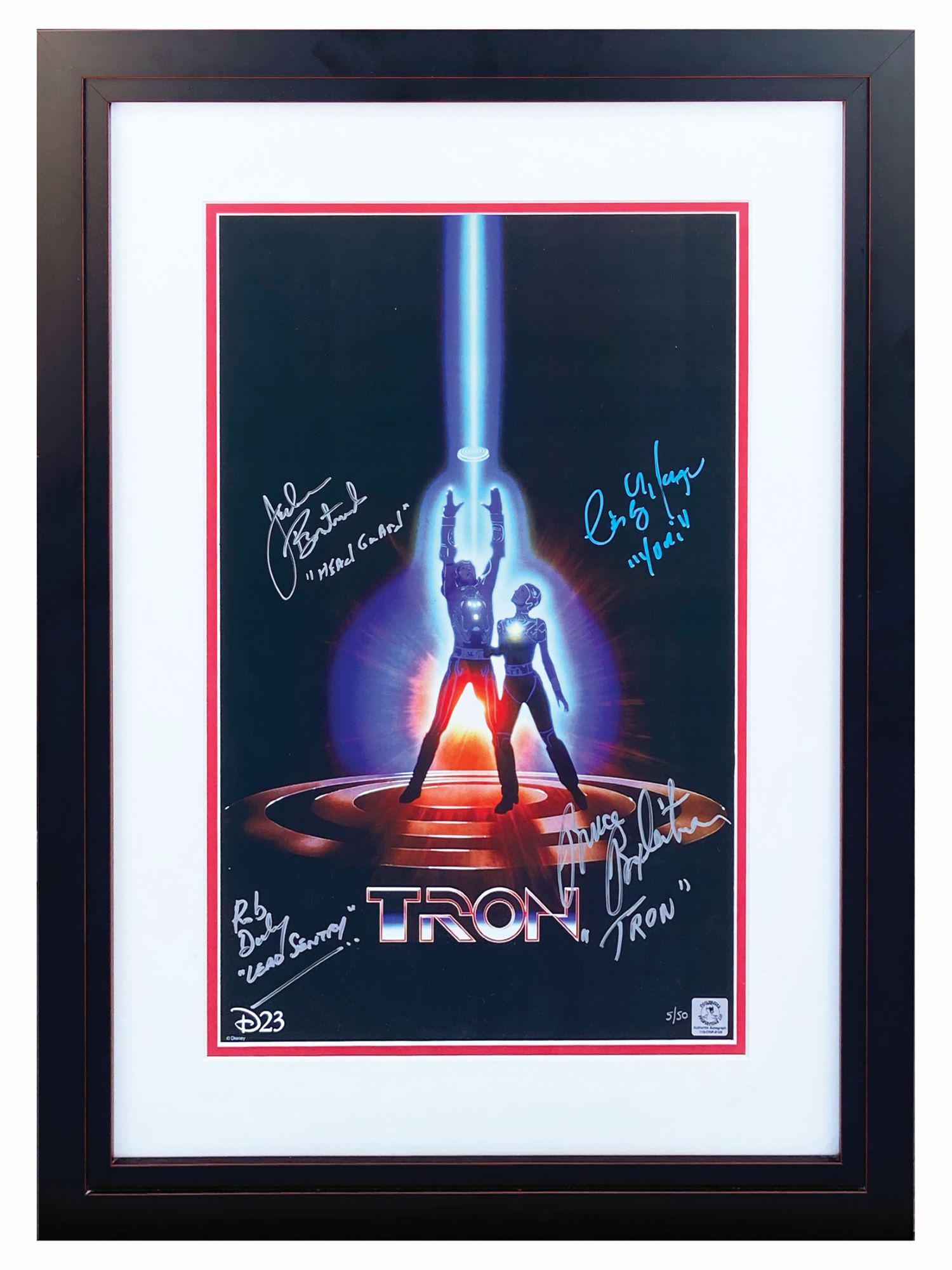 Multi-Signed Tron Poster Print.: (Disney, c.2011) A multi-signed limited edition art print featuring the image from the Tron one sheet poster. The print has been signed by the film's cast members Bruce Boxleitner (Tron), Cindy Morgan