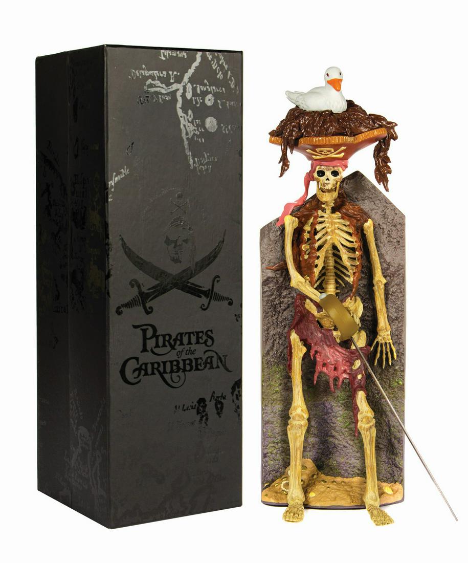 Pirates of the Caribbean Bird Head Skeleton Figure.: (Disneyland, 2008) A vinyl figure of the skeleton with a bird on its head as seen early in the Pirates of the Caribbean attraction. Created by Span of Sunset, the figure includes two metal swords, and