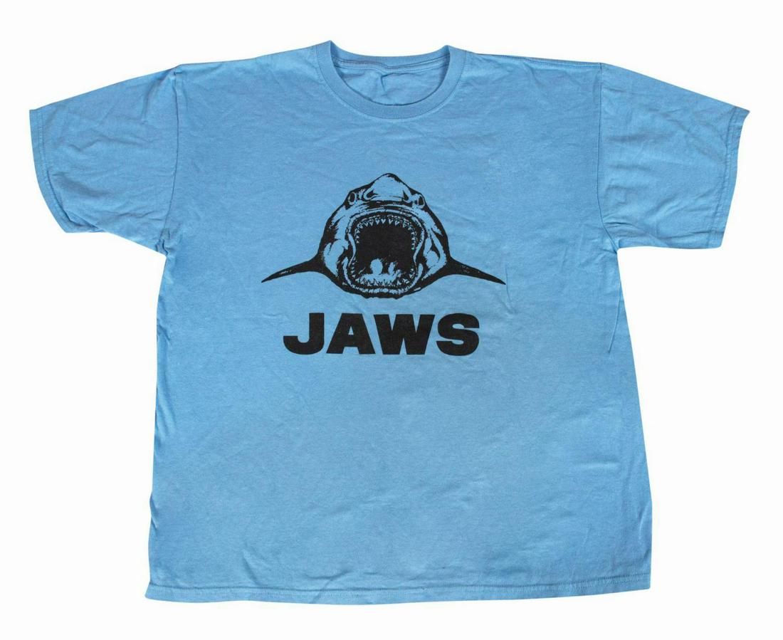 Jaws Cast and Crew T-Shirt.: (Universal, 1975) A t-shirt created for the cast and crew of the classic thriller, Jaws. These shirts were given exclusively to those affiliated with the project and feature the film's title and the m